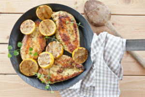 Lemon chicken in a traditional pan