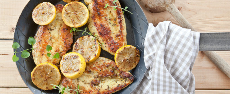 Lemon chicken in a traditional pan