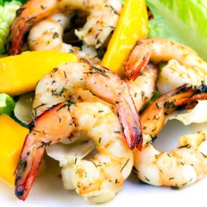 Grilled prawns with herbs and a mango salad