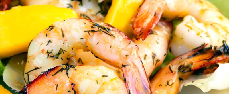 Grilled prawns with herbs and a mango salad