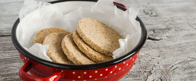 Stack of oat cakes in a red bowl